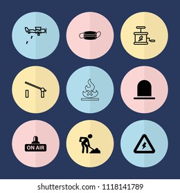 Set of 9 danger filled and outline icons such as siren, digging man, open air, medical mask, voltage warning, barrier, dynamite, military plane