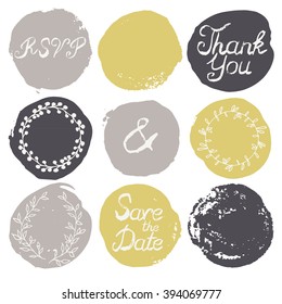 Set of 9 decorative wedding and romantic elements. Watercolour hand drawn circles with grungy lettering and floral decorations. Trendy black, grey and yellow shapes with rough edges isolated on white