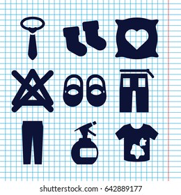 Set of 9 fabric filled icons such as baby socks, pillow with heart on it, baby shoes, spray bottle, dirty laundry, no bleaching, tie