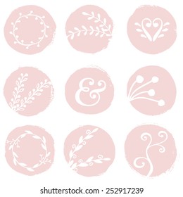 A set of 9 hand drawn blush pink circles with floral decorative elements isolated on white.