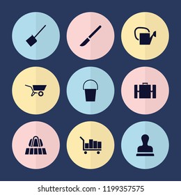 Set of 9 handle filled icons such as luggage belt, wheel barrow, stamp, luggage, bucket, watering can, scalpel, dustpan