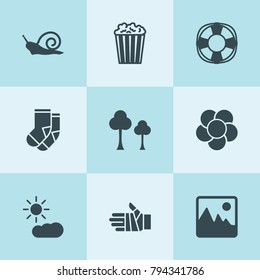 Set of 9 pattern filled icons such as tree, popcorn, socks, bandaged hand, sun cloud, lifebuoy, snail, landscape