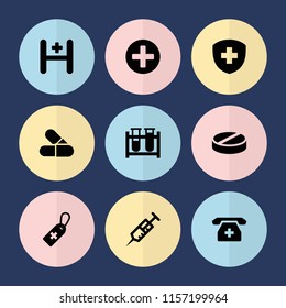 Set of 9 pharmacy filled icons such as syringe, medical cross tag, test tube, pill, hospital, medical phone, plus
