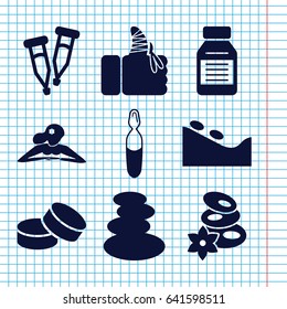 Set of 9 therapy filled icons such as spa stones, woman in spa, spa stone, tablet, pipette, medical ampoule, injured finger