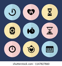 Set of 9 time filled icons such as calendar, stopwatch camera, sundial, wrist watch with sun, hourglass, stopwatch