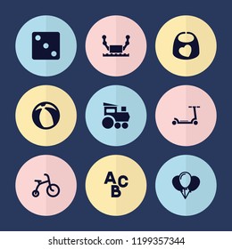 Set of 9 toy filled icons such as child bicycle, dice, balloon, robot, kick scooter, baby bid, train toy, abc