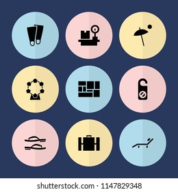 Set of 9 vacation filled icons such as do not disturb, luggage, luggage weight, umbrella, flip flops, suitcase, sunbed, flippers