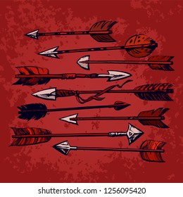 Set of 9 vintage ethnic indian arrows isolated on red old shabby background. Hand drawn vector illustration in boho sketch style.  Design elements for T-shirt or tattoo.