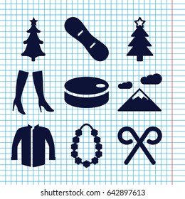 Set of 9 winter filled icons such as woman boots, jacket, christmas tree, christmas tree, candy cane, garland, hockey puck, snow board