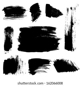 Set of abstract brush strokes on paper. Vector