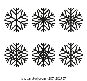 A set of abstract festive snowflakes of round shape