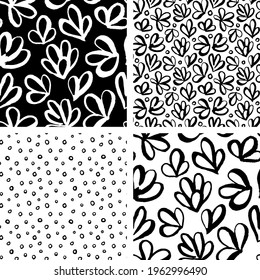 Set of abstract flower, circles, dots seamless pattern in doodle style. Modern Artistic hand drawn with brush on black, white background. Contemporary White polka dot ink over paper.