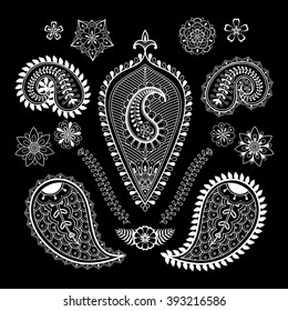 Set of abstract flowers and paisley elements in Indian mehndi style. Hand drawn ethnic elements in doodle style. Zentangle patterned vector illustration.