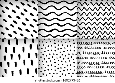 Set of abstract ink brush pen drawing seamless patterns. Vector art. Black scribble and white background.