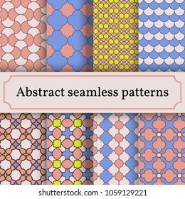 Set of abstract seamless patterns from primitive figures in blue, pink and green tones