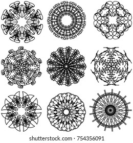 Set of abstract symbolic black patterns, design elements, isolated on white. A collection of round ethnic ornaments. A pattern for embroidery. Sketches for tattoos.
