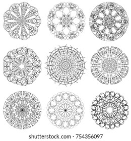 Set of abstract symbolic black patterns, design elements, isolated on white. A collection of round ethnic ornaments. A pattern for embroidery. Sketches for tattoos.