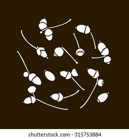 Set of acorns white silhouettes on a brown background . Vector illustration .