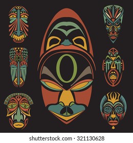 Set of African Ethnic Tribal masks on black background. Flat icons. Ritual symbols.