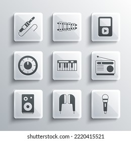 Set Air headphones, Microphone, Radio, Music synthesizer, Stereo speaker, Sound mixer controller, Audio jack and player icon. Vector