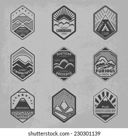 Set of alpinist and mountain climbing outdoor activity vector logos. Logotype templates and badges with mountains, peaks, creeks, trees, sun, tent. National parks and nature exploration symbols