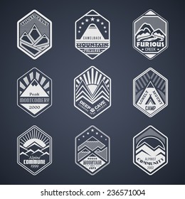 Set of alpinist and mountain climbing outdoor activity vector logos on black.Logotype templates and badges with mountains, peaks, creeks, trees, sun, tent.National parks and nature exploration symbols