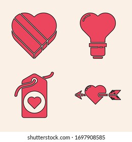 Set Amour with heart and arrow, Candy in heart shaped box, Heart shape in a light bulb and Heart tag icon. Vector