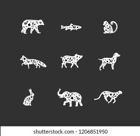 Set of animals floral graphic silhouettes bear, fish, monkey, fox, pig, dog, rabbit, elephant, cheetah drawing on dark background