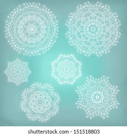 Set of arabesques. Lace ethnic ornament in a circle. Snowflakes.Vector illustration.