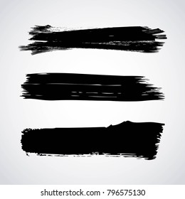 set of artistic black paint hand made creative ink brush strokes isolated on white background