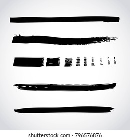 set of artistic black paint hand made creative ink brush strokes isolated on white background
