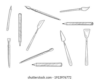 A set of artistic elements. Brushes, pencils, and palette knives. Vector illustration.