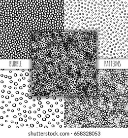 Set of artistic hand drawn water seamless ink patterns. Black and white brush strokes - bubbles. Repeatable doodle sketch design for print, textile, wrapping paper.