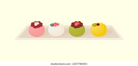 Set of asian desserts on plate - various wagashi, mochi, rice cake with decoration