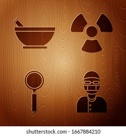 Set Assistant, Mortar and pestle, Magnifying glass and Radioactive on wooden background. Vector