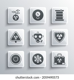 Set Atom, Radiation nuclear suitcase, Radioactive in shield, Gas mask, Power button, Triangle with radiation,  and waste barrel icon. Vector