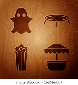 Set Attraction carousel, Ghost, Popcorn in cardboard box and Jumping trampoline on wooden background. Vector