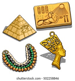 Set of attributes and jewelry on the theme of ancient Egypt isolated on white background. Golden pendant in the shape of the head of Cleopatra, miniature pyramid, necklace with semiprecious stones.