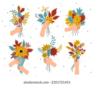 A set of autumn compositions. The hand holds a bouquet with yellow leaves. Fingers and a bouquet of orange branches. Fall leaves