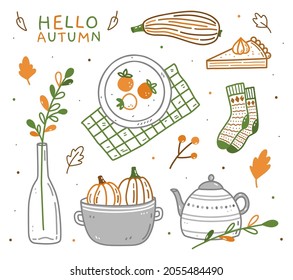 Set of autumn elements - warm socks, teapot, pumpkins, zucchini, vase with twig, pumpkin pie and persimmons. Hand-drawn vector doodle illustration. Perfect for cards, holiday designs, decorations.