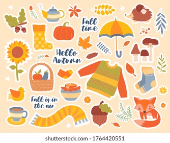 Set of autumn or fall seasonal icons with clothing, boots, food, fox, leaves and hot beverages interspersed with text, colored vector illustration