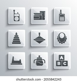 Set Baby bottle, ABC blocks, bib, Whirligig toy, potty, Pyramid, Monitor Walkie Talkie and  icon. Vector