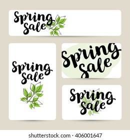 Set of banner templates with hand drawn ink brush lettering "spring sale" on white background with spring leaves. Vector calligraphy for your print or web design: discount cards, banner or tags.