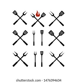 Set of barbecue tools icon. Fork and spatula for barbecue grill logo