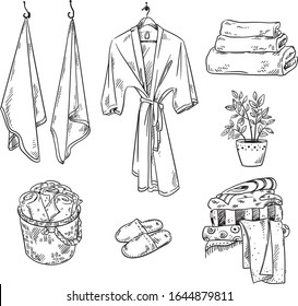 Set of bathroom textile objects: towels, robe, slippers