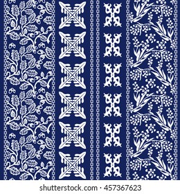 Set of batik borders. Floral seamless pattern, paisleys, leaves stripes, gypsy and ethnic motifs. Ethnic textile collection. White on dark blue. 
