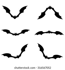 Set of bats flying black color on white background. Vector illustration.