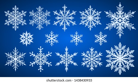 Set of beautiful complex Christmas snowflakes, white on blue background