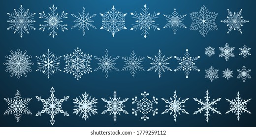 Conjunto de hermosos complejos copos de nieve navideños, blanco sobre fondo azul