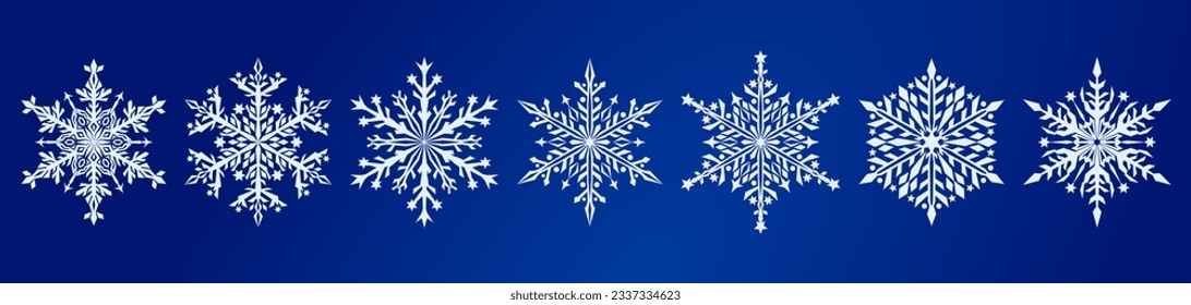 Set of beautiful complex Christmas snowflakes, white on blue background
